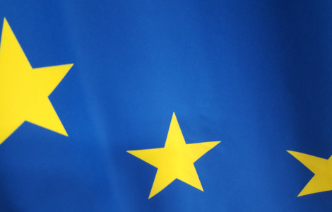 zastava EU (Part of the flag of the European Union. Blue fabric with three yellow stars.)