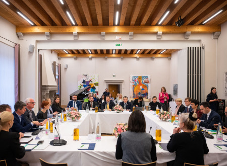 Tables with white tablecloths form a square, representatives of the Slovenian Ministry of Culture and the countries of the Western Balkans sit behind the tables