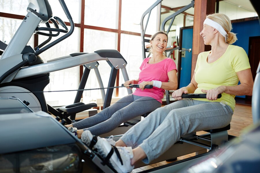 Two women exercising in the gym