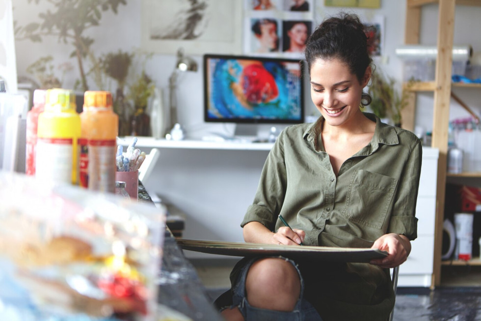 A painter painting on canvas