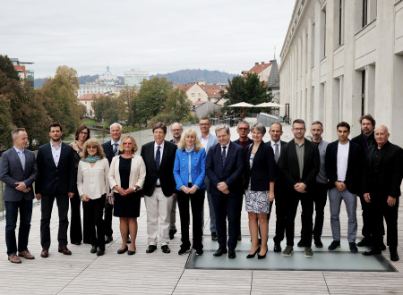 Group photos of the winners on the terrace of the Rog center. In the background, the view of Ljubljana.