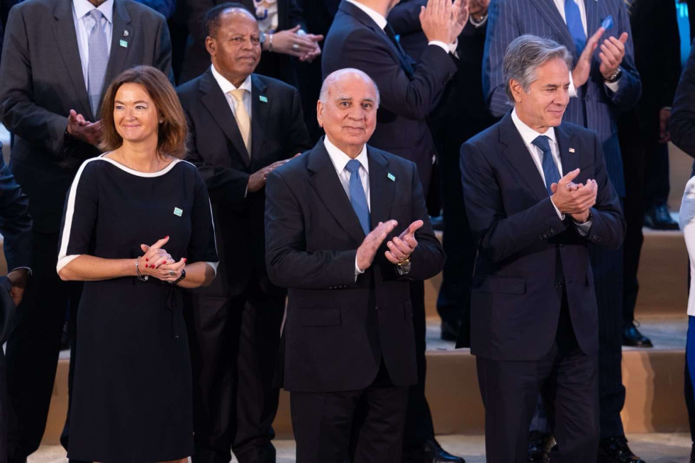 minister Fajon standing, together with others, clapping