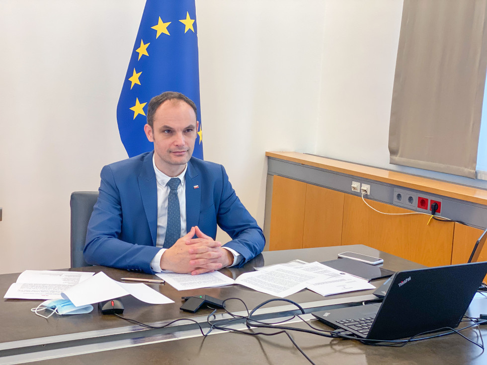 minister sitting at the computer