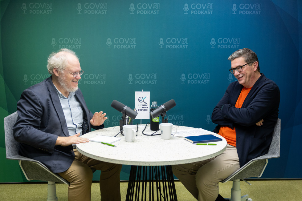 Nicholas Cull and Zoran Potič sitting at a round table